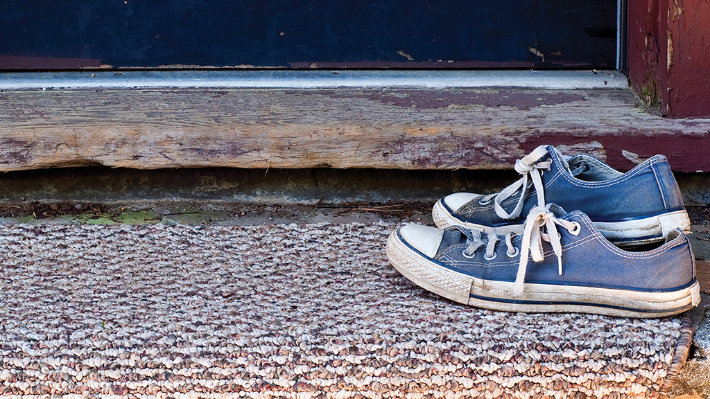 Two shoes outside a home