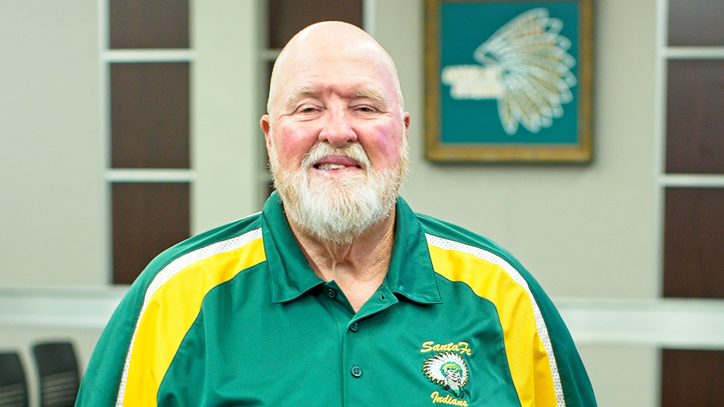 A school board member from Sante Fe, Texas, looks at the camera