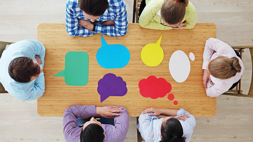 An illustration shows six adults sitting around a table with a word bubble in front of each person. 