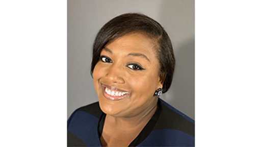 A close-up photo shows a woman smiling at the camera. 