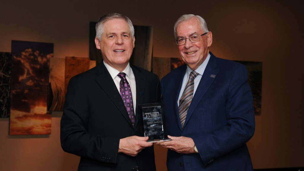 Hanks and COSA Chair hold the distinguished leadership award